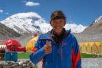 May 9,2020 -- Mountain guide Migmar Toinzhub from Himalaya Expedition Co. Ltd poses for a photo at the Mount Qomolangma base camp in southwest China`s Tibet Autonomous Region, May 8, 2020. Participants have been well prepared to ensure the accomplishment of the mission to remeasure the height of Mount Qomolangma. (Xinhua/Purbu Zhaxi)
