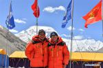 May 9,2020 -- Surveyors Zheng Lin (L) and Wu Guangwei pose for a group photo at the Mount Qomolangma base camp in southwest China`s Tibet Autonomous Region, May 8, 2020. Participants have been well prepared to ensure the accomplishment of the mission to remeasure the height of Mount Qomolangma. (Xinhua/Jigme Dorje)