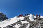 May 18,2020 -- A team of Chinese remeasuring surveyors hike toward the advance camp at an altitude of 6,500 meters on Mount Qomolangma, May 17, 2020. The team is expected to reach the summit on May 22 if weather conditions permit. Starting from the base camp at an altitude of 5,200 meters, the team will typically take about a week to reach the summit, passing through five camps at an altitude of 5,800 meters, 6,500 meters, 7,028 meters, 7,790 meters and 8,300 meters, respectively. (Photo by Lhagba/Xinhua)