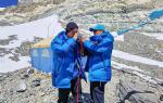 May 19,2020 -- Wang Wei (L), a surveyor from the Ministry of Natural Resources, practices using oxygen mask at an altitude of 6,500 meters on Mount Qomolangma, May 18, 2020. A Chinese mountaineering team on Monday released a list of 12 people, including two surveyors, who will climb to the peak of Mount Qomolangma. If everything goes smoothly, they will arrive at the peak on May 22 to conduct surveys in gravity, global navigation satellite systems, weather and depths of ice and snow. Chen Gang and Wang Wei, both of whom are surveyors from the Ministry of Natural Resources, are on the list. If either of them manages to arrive at the peak, it will set a record for Chinese surveyors setting foot on the world`s highest mountain peak, according to the team. The names of a support squad and a backup squad were also released on Monday. (Xinhua/Lhapa)