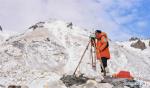May 28,2020 -- Chinese surveyor Zheng Lin conducts surveying at Mount Qomolangma base camp in southwest China`s Tibet Autonomous Region on May 27, 2020. A Chinese survey team reached the summit of Mount Qomolangma Wednesday, and remeasured the height of the world`s highest peak. After summiting at 11 a.m., the eight-member team erected a survey marker and installed a GNSS antenna on the snow-covered peak, which measures less than 20 square meters, while other surveyors conducted observations from six points beneath the peak. (Xinhua/Purbu Zhaxi)