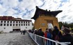 June 4,2020 -- Visitors wait to enter the Potala Palace in Lhasa, capital city of southwest China`s Tibet Autonomous Region, June 3, 2020. The Potala Palace reopened to the public on Wednesday. Visitors to the Potala Palace must first make online reservations while their number will be strictly controlled, according to an announcement issued Tuesday by the administration of the palace. The 1,300-year-old palace has been closed since Jan. 27 due to the spread of the novel coronavirus. (Xinhua/Chogo)