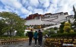 June 4,2020 -- Visitors head for the Potala Palace in Lhasa, capital city of southwest China`s Tibet Autonomous Region, June 3, 2020. The Potala Palace reopened to the public on Wednesday. Visitors to the Potala Palace must first make online reservations while their number will be strictly controlled, according to an announcement issued Tuesday by the administration of the palace. The 1,300-year-old palace has been closed since Jan. 27 due to the spread of the novel coronavirus. (Xinhua/Chogo)