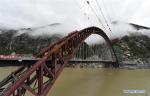 June 22,2020 -- Photo taken on June 20, 2020 shows the under-construction bridge across the Yarlung Zangbo River on the Lhasa-Nyingchi Railway in Jiacha County of Shannan City, southwest China`s Tibet Autonomous Region. The construction team completed the closure of the main girder of the 525.1-meter bridge on Saturday. (Xinhua/Chogo)