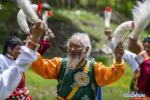 July 21,2020 -- Nyima performs Jiuhe Zhuo dance in Jiuhe Village of Qonggyai County in Shannan, southwest China`s Tibet Autonomous Region, July 1, 2020. Jiuhe Zhuo dance, originated in Qonggyai County of Shannan, has a history of more than 1,300 years. It has been a favorite dancing form for local people in Shannan to pray for good luck since ancient times and was dubbed waist drum dance in Tibet. Nyima, an inheritor of Jiuhe Zhuo dance, which is a national intangible cultural heritage, began to learn the dance from his father at the age of nine and has been dedicated to Zhuo dance performance for over 60 years. His performance once won a national award for folk arts. After decades of study of the dance, Nyima has formed his unique style. During the performance, he plays the role of leading dancer and controls the movements and rhythm of the dance. Nyima has trained dozens of apprentices and formed a Zhuo dance performing team in Jiuhe Village. Now, young dancers of the team often perform in different places. The Zhuo dance has become an important approach to reducing poverty for local villagers. (Xinhua/Sun Fei)