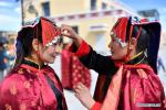 Aug.3,2020 -- Local residents get dressed up before a Guge Xuan Dance performance in Zanda County of Ali Prefecture, southwest China`s Tibet Autonomous Region, July 27, 2020. The dance is a Tibetan cultural heritage from the ancient Guge Kingdom that mixes speech, singing and dancing. (Xinhua/Zhan Yan)