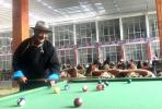 Aug.3,2020 -- A resident plays billiards in the nursing home. [Photo by Palden Nyima/chinadaily.com.cn]