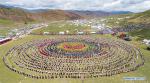Aug.10,2020 -- Aerial photo shows people performing Xianzi Dance in Mangkam County, southwest China`s Tibet Autonomous Region, Aug. 7, 2020. Xianzi Dance, a traditional folk dance in Tibet, was listed as a national intangible heritage in 2006. (Xinhua/Sun Fei)