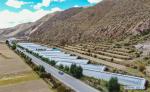 Sept.27,2020 -- Aerial photo shows greenhouses in Yazhong Village of Qamdo, southwest China`s Tibet Autonomous Region, Sept. 21, 2020. Greenhouse vegetable planting developed in Yazhong Village provides jobs for impoverished villagers here and helps boost their income. (Xinhua/Jigme Dorje)