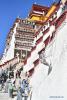 Oct.29,2020 -- Workers paint the wall of the Potala Palace during an annual renovation of the ancient architectural complex in Lhasa, capital of southwest China`s Tibet Autonomous Region, Oct. 28, 2020. (Xinhua/Jigme Dorji)