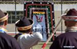 Nov.23,2020 -- Amateur archers take part in the traditional `Gongbo archery` competition in Nyingchi, southwest China`s Tibet Autonomous Region, Nov. 19, 2020. A traditional archery competition was held in Nyingchi on Thursday to celebrate the Gongbo New Year. This year, more than 260 archery enthusiasts from Nyingchi participated in the competition. `Gongbo archery`, with a history of over 1,500 year, is a traditional folk sports competition which is unique to Nyingchi. It has been listed as an intangible cultural heritage of Tibet. There are small holes on the wooden cone head of the arrow. When the arrow flies to target, the air passes through the hole and makes a sharp whistling sound. A cloth curtain with a leather target is hung on the other side of the arena. After hitting the target, the arrow falls off together with the inner ring of leather target. (Xinhua/Purbu Zhaxi)