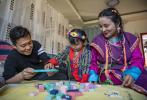 Feb. 18, 2021 -- Zhang Chunhuan and his wife Tashi Yudron play toy bricks with their daughter at home in Medog, southwest China`s Tibet Autonomous Region, Feb. 11, 2021. (Xinhua/Sun Fei)