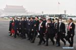 March 5,2021 -- Deputies to the 13th National People`s Congress (NPC) walk towards the Great Hall of the People for the opening meeting of the fourth session of the 13th NPC in Beijing, capital of China, March 5, 2021. (Xinhua/He Changshan)