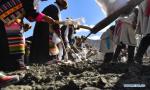 March 17,2021 -- People take part in a ceremony marking the start of spring ploughing in Shannan, southwest China`s Tibet Autonomous Region, March 16, 2021. (Xinhua/Jigme Dorje)