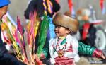 March 17,2021 -- A little girl takes part in a ceremony marking the start of spring ploughing in southwest China`s Tibet Autonomous Region, March 16, 2021. (Xinhua/Chogo)