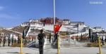 March 29,2021 -- A flag-raising ceremony is held to celebrate the Serfs` Emancipation Day at the square in front of the Potala Palace in Lhasa, capital of southwest China`s Tibet Autonomous Region, March 28, 2021. (Xinhua/Jigme Dorge)