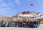 March 29,2021 -- People pose for a group photo to celebrate the Serfs` Emancipation Day at the square in front of the Potala Palace in Lhasa, capital of southwest China`s Tibet Autonomous Region, March 28, 2021. (Xinhua/Jigme Dorge)