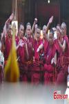 April 6,2021 -- Buddhist monks attend a debate activity, a part of the award ceremony of the degree of Geshe Lharampa held in the Jokhang Temple in Lhasa, capital of southwest China`s Tibet Autonomous Region, April 5, 2021. Thirteen Tibetan Buddhist monks from 13 temples across Tibet were awarded the degree of Geshe Lharampa on Monday. Geshe Lharampa is the highest academic degree for the Tibetan Buddhists, with a history of 400 years. (China News Service/Jiang Feibo)