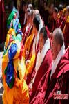 April 6,2021 -- Buddhist monks attend the award ceremony of the degree of Geshe Lharampa held in the Jokhang Temple in Lhasa, capital of southwest China`s Tibet Autonomous Region, April 5, 2021. Thirteen Tibetan Buddhist monks from 13 temples across Tibet were awarded the degree of Geshe Lharampa on Monday. Geshe Lharampa is the highest academic degree for the Tibetan Buddhists, with a history of 400 years. (China News Service/Jiang Feibo)