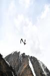 May 11, 2021 -- Birds fly around the Sapukonglagabo Mountain in Biru County of Nagqu, southwest China`s Tibet Autonomous Region, May 4, 2021. (Xinhua/Sun Ruibo)