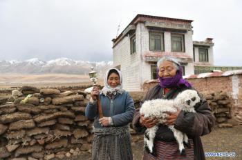 Former serf enjoys happy life after democratic reform in Tibet