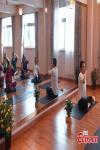 July 8,2021 -- People practice yoga in a studio at Chengguan District in Lhasa, China`s Tibet autonomous region on July 6, 2021. The local yoga studio offers free training courses for the elderly, which is popular among the enthusiasts. (Photo/ China News Service)