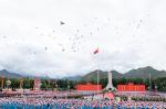 Aug.20,2021 -- Pigeons fly over the sky during a grand gathering to celebrate the 70th anniversary of the peaceful liberation of Tibet at the Potala Palace square in Lhasa, southwest China`s Tibet Autonomous Region, Aug. 19, 2021. More than 20,000 people from various ethnic groups attended the event held in Lhasa. (Xinhua/Zhai Jianlan)