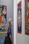 Aug.27,2021 -- A visitor enjoys the Tibetan Thangka artworks in Valletta, capital city of Malta, on Aug. 25, 2021. A Tibetan Thangka art exhibition, with the theme of `China`s Tibet, Tashi Delek,` opened in Malta on Friday to mark the 70th anniversary of Tibet`s peaceful liberation. (Xinhua/Chen Wenxian)