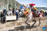 Sept.1,2021 -- A rider competes during a horse race in Gangdan Village of Gonggar County, southwest China`s Tibet Autonomous Region, Aug. 26, 2021. An annual horse racing event was held here on Thursday to celebrate the upcoming harvest season. (Xinhua/Sun Ruibo)
