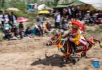 Sept.1,2021 -- A rider competes during a horse race in Gangdan Village of Gonggar County, southwest China`s Tibet Autonomous Region, Aug. 26, 2021. An annual horse racing event was held here on Thursday to celebrate the upcoming harvest season. (Xinhua/Sun Fei)