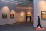 Visitors appreciate Tibet-themed paintings at the Natural Science Museum in Lhasa, capital of southwest China`s Tibet Autonomous Region, Sept. 26, 2021. (China News Service/Gongga Laisong)