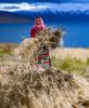 A villager harvests highland barley at Ombu Township, Nyima County, Nagqu City of southwest China`s Tibet Autonomous Region, Sept. 23, 2021. (Xinhua/Purbu Zhaxi)