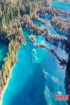 Aerial photo of the Sparkling Lake (Huo Hua Hai) at Jiuzhaigou National Park in the Aba Tibetan and Qiang Autonomous Prefecture, southwest China`s Sichuan Province, Jan. 5, 2022. (Photo by An Yuan)