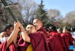 Monks set up a pole wrapped with prayer flags onto it during a ceremonial event at Tashilumpo Monastery in Xigaze City of southwest China`s Tibet Autonomous Region, March 7, 2022. A ceremonial event was held at the monastery on Monday. (Xinhua/Chogo)
