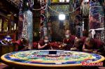 Monks work on a mandala sand painting at the Kundeling Monastery, Lhasa, capital of southwest China`s Tibet Autonomous Region, March 9, 2022. (Photo provided to China News Service)