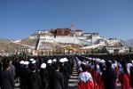 A flag-raising ceremony is held at Potala Palace Square in Lhasa, Tibete, to celebrate the 63rd Serfs Emancipation Day on Monday. [Photo provided to chinadaily.com.cn]