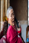 Yabao, 74, makes a phone call in Namyi Lhoba Ethnic Township of Mainling County, southwest China`s Tibet Autonomous Region, April 12, 2022.