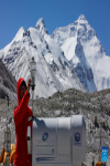 A scientific research member checks a microwave radiometer at the Mount Qomolangma base camp on May 3, 2022. [Photo/Xinhua]