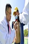 A medical expert carries out CHD screening for a student in Qushui County of Lhasa, capital of southwest China`s Tibet Autonomous Region, April 22, 2022. (Xinhua/Li Jian)