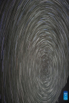 Composite photo taken on May 4, 2022 shows star trails above the Mount Qomolangma base camp. (Xinhua/Jiang Fan)
