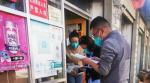 Residents follow the city`s rules on COVID-19 prevention and control to enter a shop in Nimu county of Lhasa, capital of Southwest China`s Tibet autonomous region. [Photo provided to chinadaily.com.cn]
