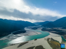 This aerial photo taken on Dec. 18, 2022 shows the scenery of Mainling section of the Yarlung Zangbo River in Mainling County of Nyingchi, southwest China`s Tibet Autonomous Region. (Photo by Dong Zhixiong/Xinhua)
