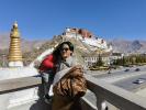 Tourists pose for photos in front of the Potala Palace in Lhasa, Tibet, on Wednesday. [Photo by Palden Nyima/For chinadaily.com.cn]
