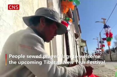 People sew prayer flags to welcome Tibetan New Year in Lhasa