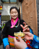 A woman prepares to taste highland barley wine to greet the Tibetan New Year, in Lhasa, southwest China`s Tibet Autonomous Region, Feb. 21, 2023.  (Xinhua/Jigme Dorje)
