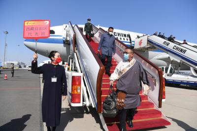 Tibet NPC deputies arrive in Beijing