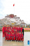 Students pose for a group photo after a national flag raising ceremony marking the 15th Serfs` Emancipation Day at a square in front of the Potala Palace in Lhasa, capital of southwest China`s Tibet Autonomous Region, March 28, 2023. The 15th Serfs` Emancipation Day falls on Tuesday. (Xinhua/Zhang Rufeng)
