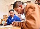 Lhaba Cering (L) instructs as an apprentice draws woodcarving sketch in Lhasa, capital of southwest China`s Tibet Autonomous Region, April 25, 2023.(Xinhua/Jigme Dorje)