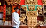 Lhaba Cering displays his woodcarving art craft pieces in Lhasa, capital of southwest China`s Tibet Autonomous Region, April 25, 2023.(Xinhua/Jigme Dorje)