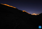 This photo taken on June 4, 2023 shows a view of Mount Qomolangma in twilight in southwest China`s Tibet Autonomous Region. (Xinhua/Fei Maohua)